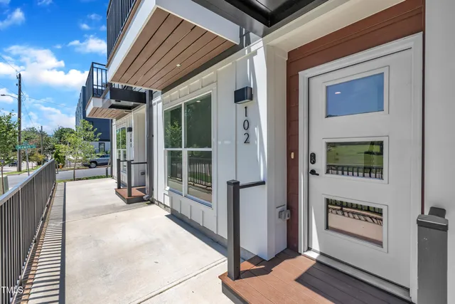 a view of a balcony with furniture