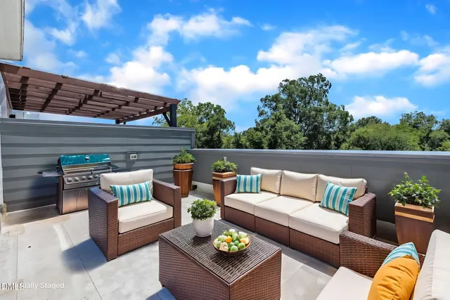 a view of a couch in the roof deck