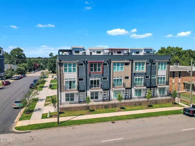 a view of houses with a street