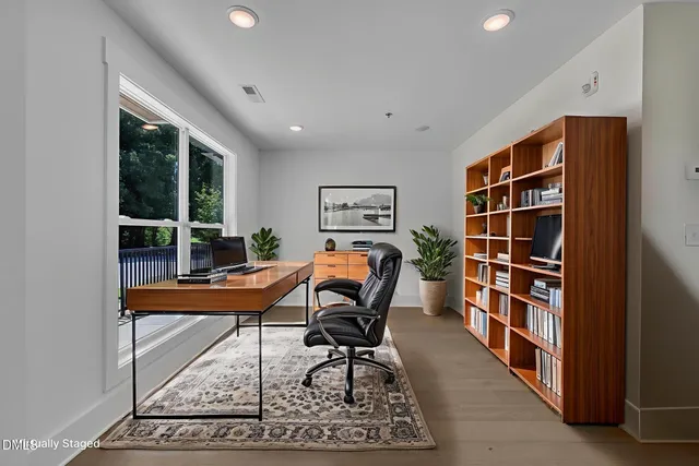 a workspace room with furniture