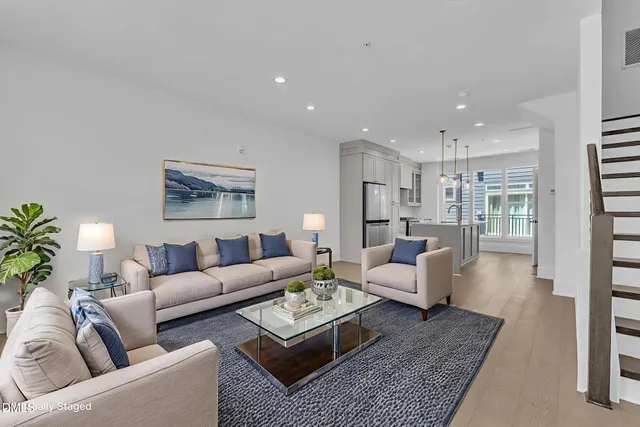 a living room with furniture and a rug