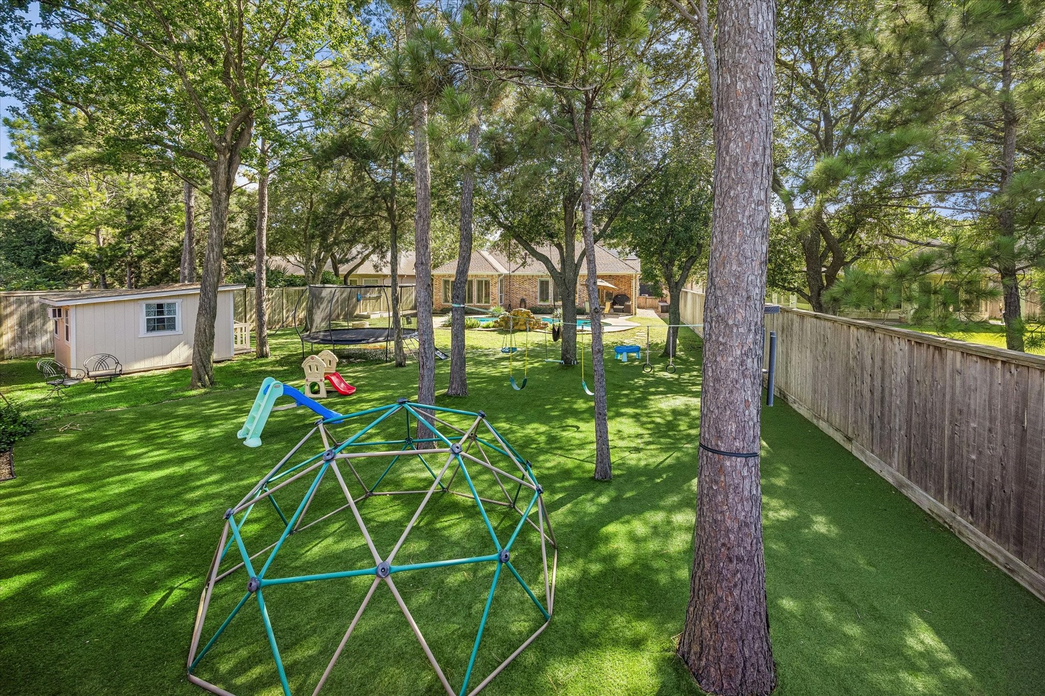 3047 Bonnebridge Way Boulevard Houston, TX 77082 - Photo 26 of 50 This backyard is a child's dream come true, featuring endless space for play and outdoor activities.