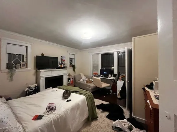 a living room with furniture fireplace and flat screen tv