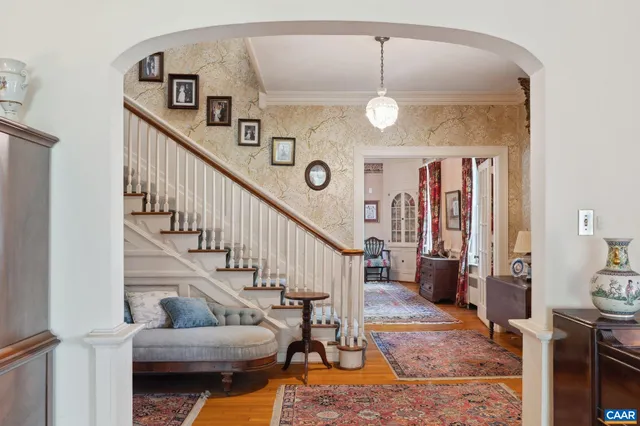 a living room with furniture a table and chairs