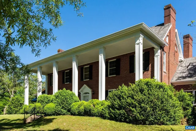 front view of a house with potted plants