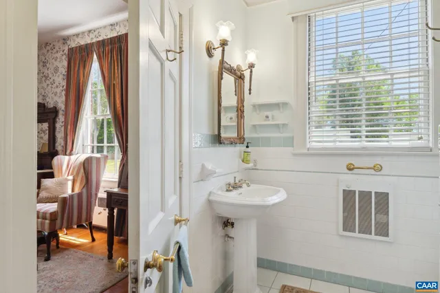 a view of a hallway with window and stairs