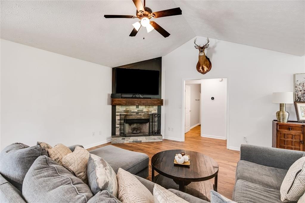 52 Castleman Road Carrollton, GA 30116 - Photo 13 of 35 a living room with furniture and a flat screen tv