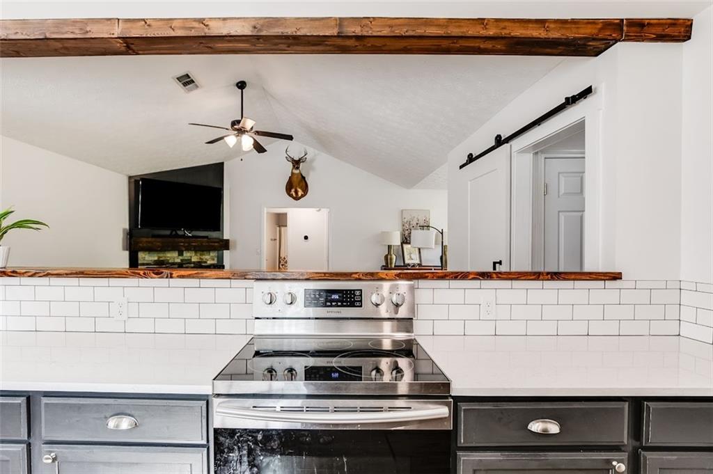52 Castleman Road Carrollton, GA 30116 - Photo 14 of 35 a kitchen with a stove and a microwave