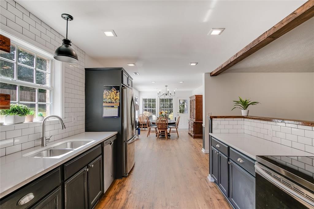 52 Castleman Road Carrollton, GA 30116 - Photo 15 of 35 a kitchen with sink stove and cabinets