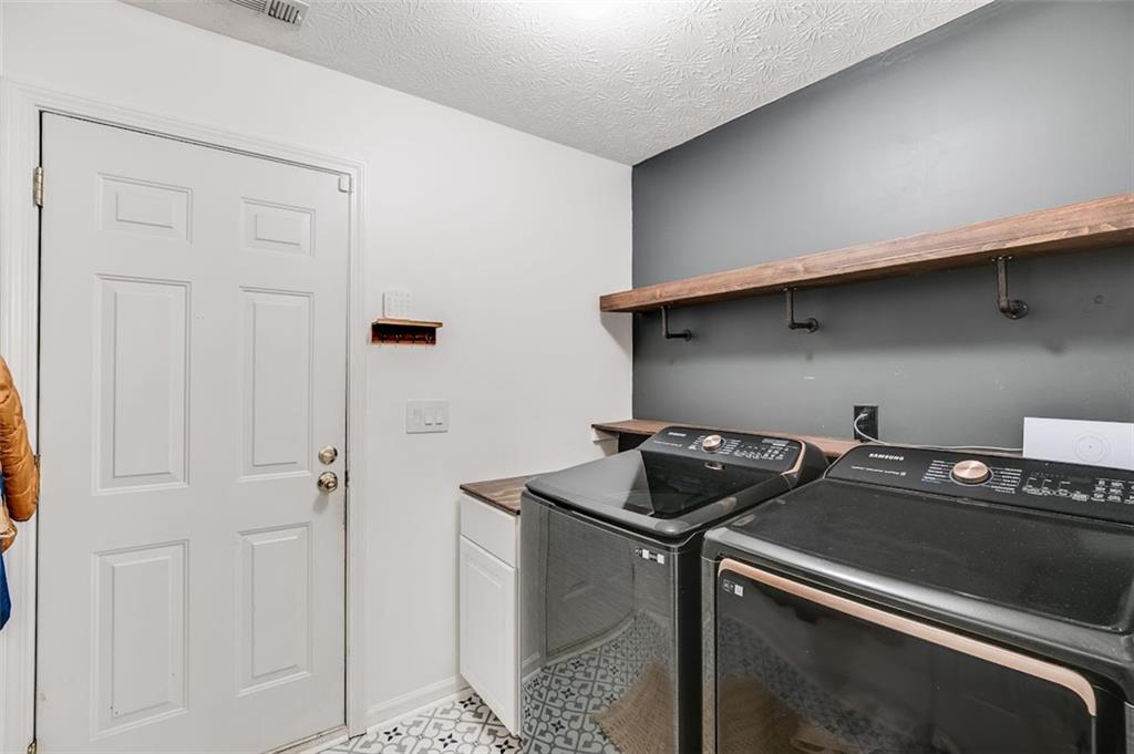 52 Castleman Road Carrollton, GA 30116 - Photo 16 of 35 a utility room with dryer and washer