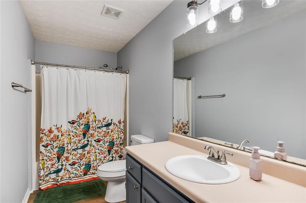 52 Castleman Road Carrollton, GA 30116 - Photo 19 of 35 a bathroom with a sink toilet and shower