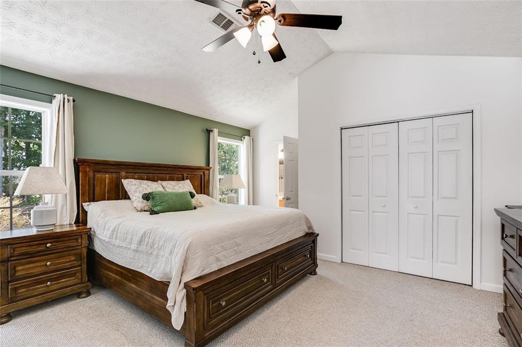 52 Castleman Road Carrollton, GA 30116 - Photo 20 of 35 a large bed sitting in a room next to a window