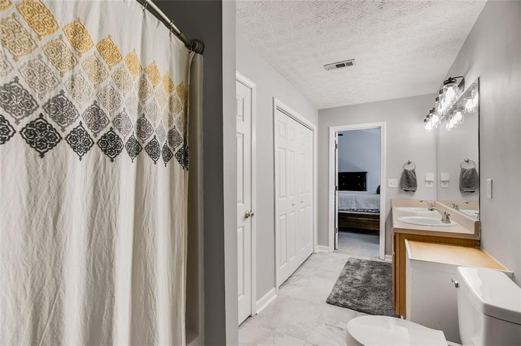52 Castleman Road Carrollton, GA 30116 - Photo 23 of 35 a en suite bathroom with a shower and a sink