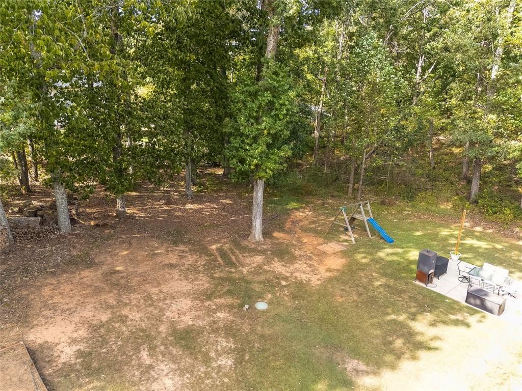 52 Castleman Road Carrollton, GA 30116 - Photo 29 of 35 a view of a yard with a tree