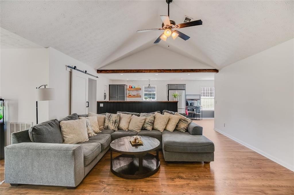 52 Castleman Road Carrollton, GA 30116 - Photo 5 of 35 a living room with furniture and a ceiling fan