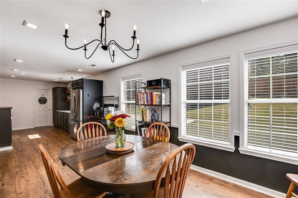 52 Castleman Road Carrollton, GA 30116 - Photo 6 of 35 a view of a dining room with furniture window and wooden floor