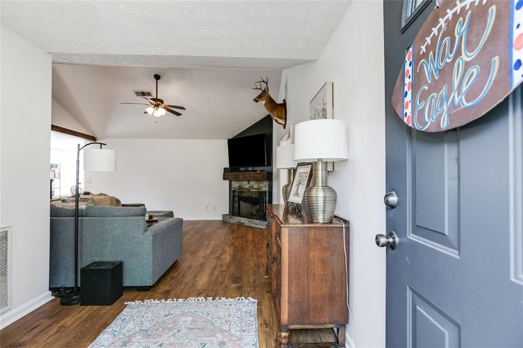 52 Castleman Road Carrollton, GA 30116 - Photo 8 of 35 a living room with furniture and a flat screen tv