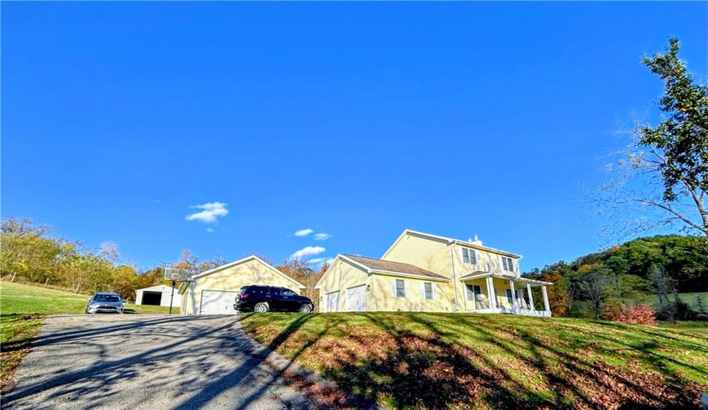 a view of a house with a yard