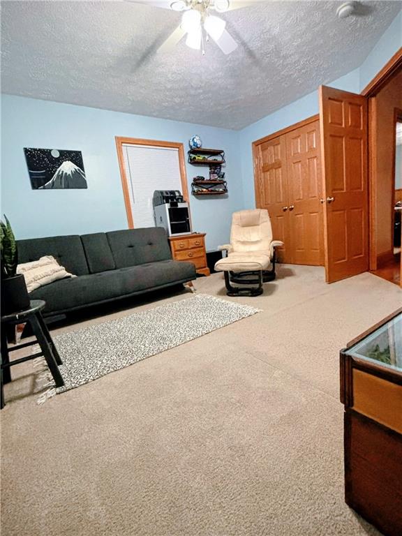 241 Lyons Road Claysville, PA 15323 - Photo 31 of 42 a living room with furniture and a window