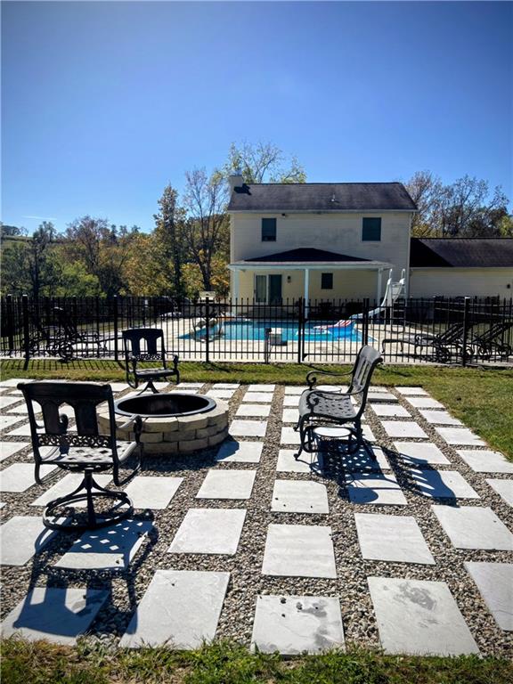 241 Lyons Road Claysville, PA 15323 - Photo 37 of 42 a view of a patio with table and chairs with wooden floor and fence