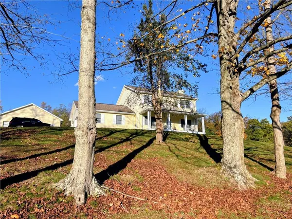 a view of a large building in the backyard