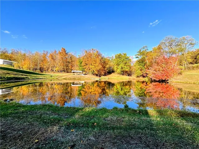a view of a lake with houses in the back