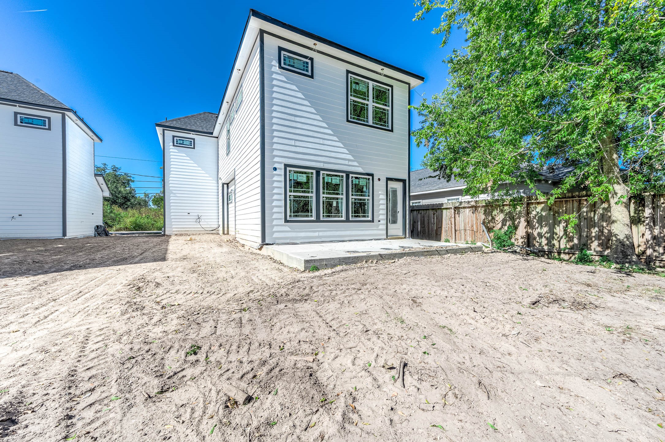 8602 Hoffman Street Houston, TX 77016 - Photo 6 of 7 a house with trees in the background