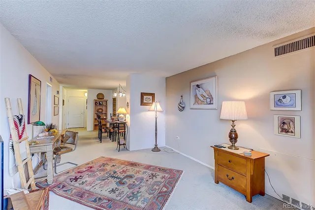 a living room with furniture and a rug