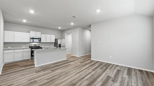 a kitchen with granite countertop a sink and a window
