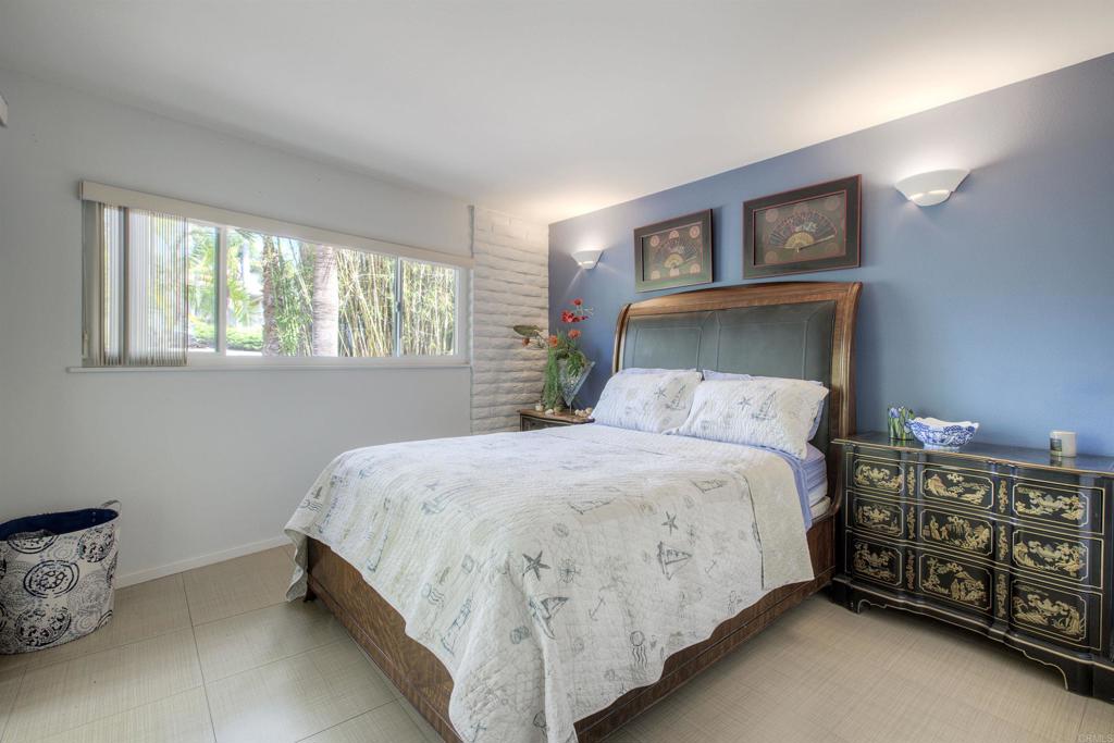 1773 Ivy Road Oceanside, CA 92054 - Photo 15 of 30 a bed sitting in a bedroom next to a window