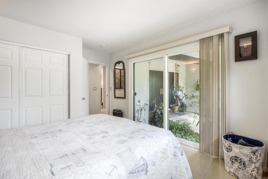 1773 Ivy Road Oceanside, CA 92054 - Photo 16 of 30 a bedroom with a bed and a window