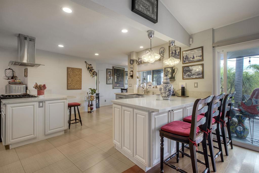 1773 Ivy Road Oceanside, CA 92054 - Photo 4 of 30 a kitchen with cabinets and chairs