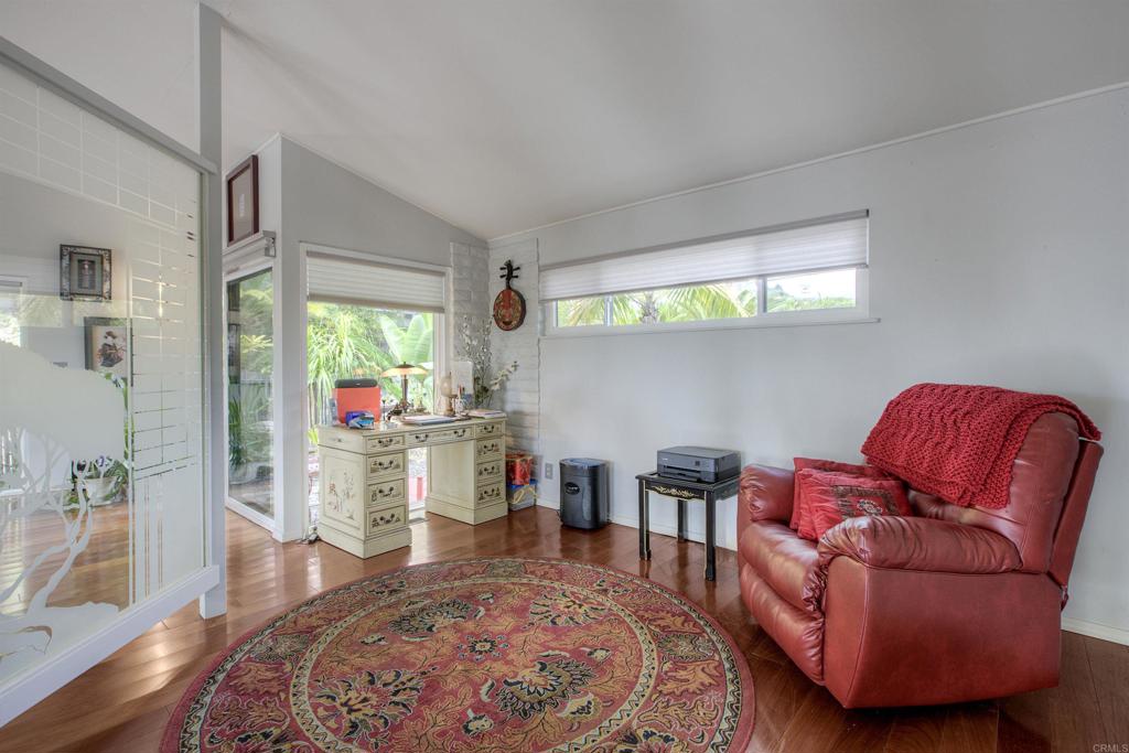 1773 Ivy Road Oceanside, CA 92054 - Photo 8 of 30 a living room with furniture and a wooden floor