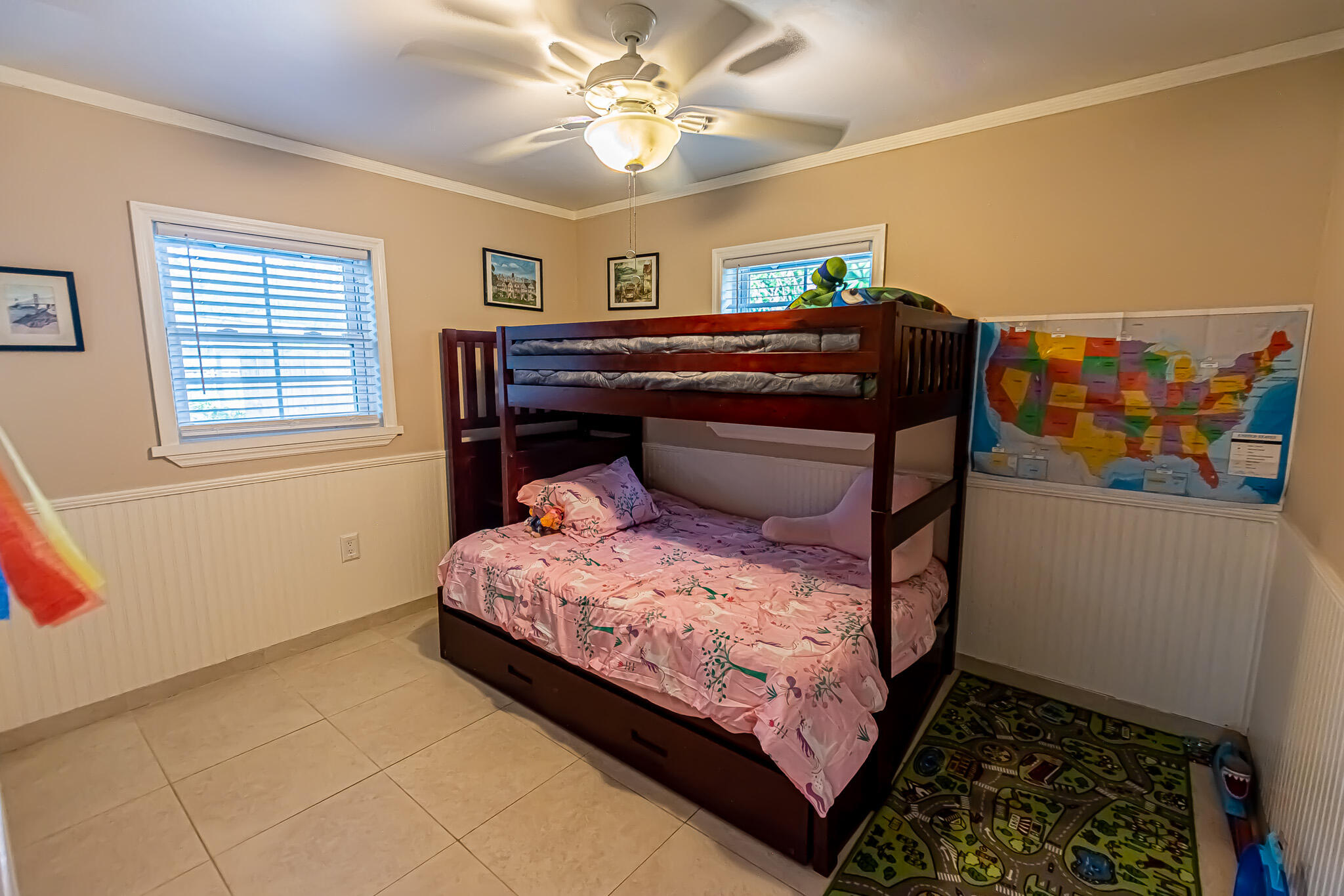 602 Azalea Avenue Fort Pierce, FL 34982 - Photo 10 of 20 a bedroom with a bed and a chandelier