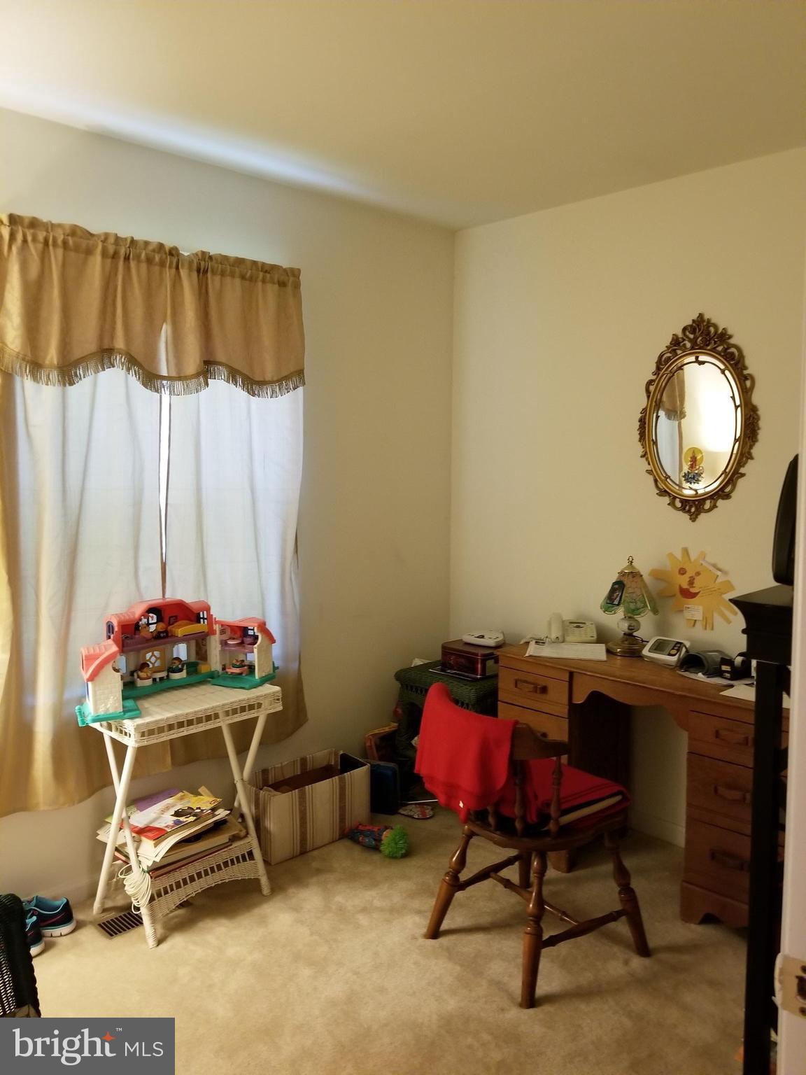 207 East Fourteenth Avenue Ranson, WV 25438 - Photo 14 of 24 a room with a table chair and a window