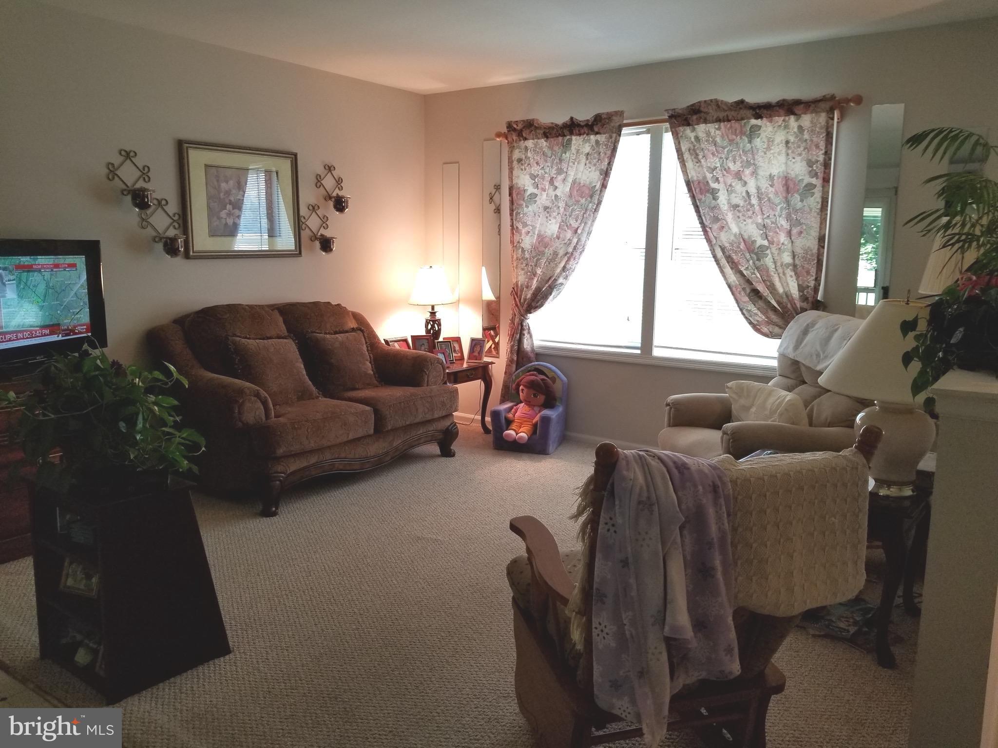 207 East Fourteenth Avenue Ranson, WV 25438 - Photo 8 of 24 a living room with furniture and a large window