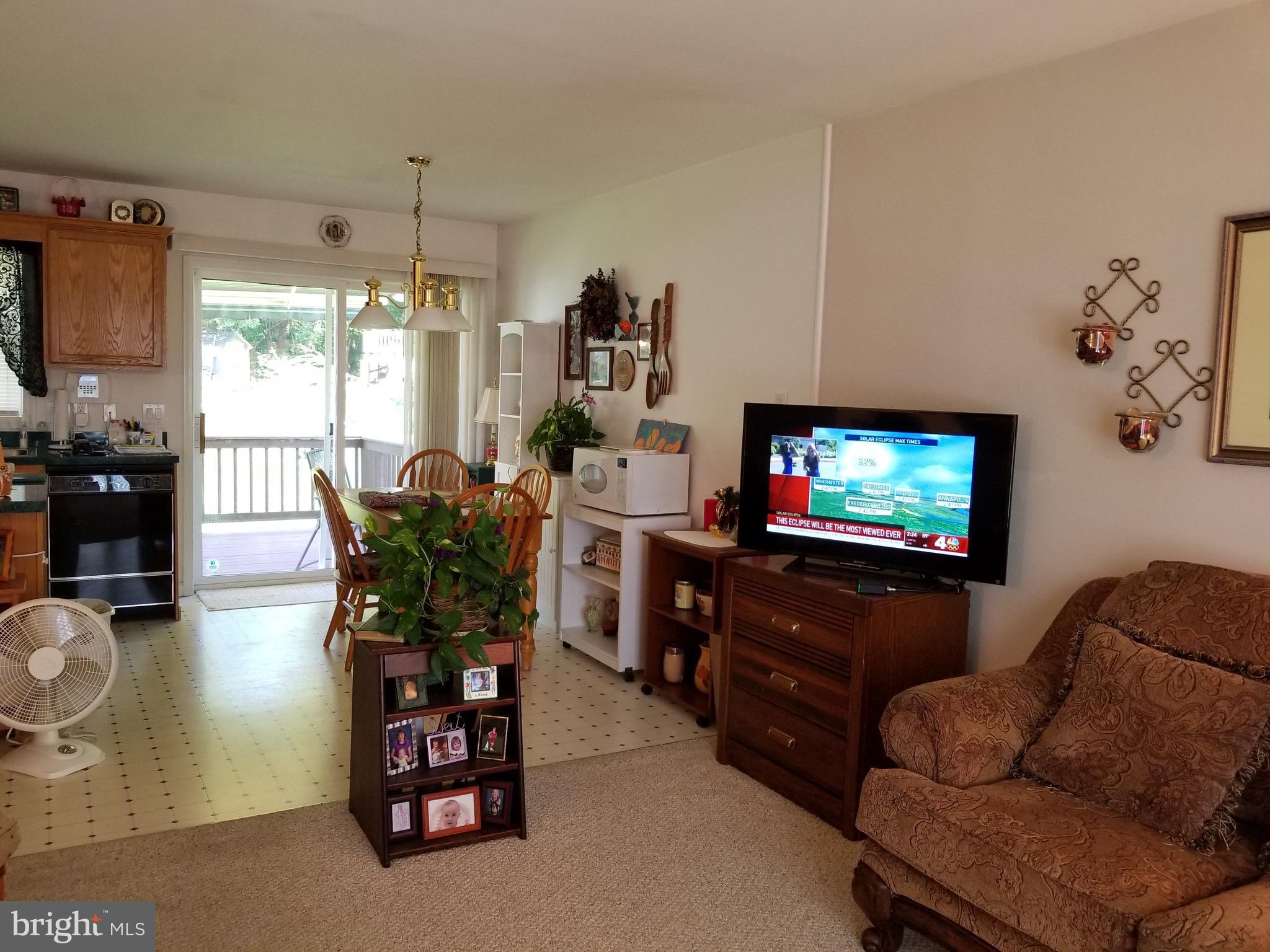 207 East Fourteenth Avenue Ranson, WV 25438 - Photo 10 of 24 a living room with furniture and a flat screen tv