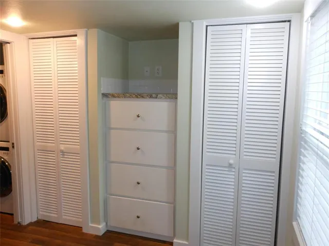 a view of a kitchen that has a window in it