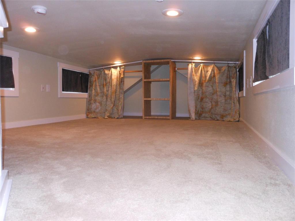 2350 East Stone Road Wylie, TX 75098 - Photo 15 of 24 a view of an empty room with windows