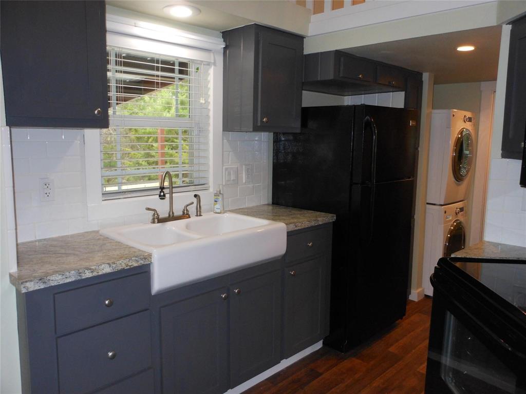 2350 East Stone Road Wylie, TX 75098 - Photo 5 of 24 a bathroom with a granite countertop sink and a mirror