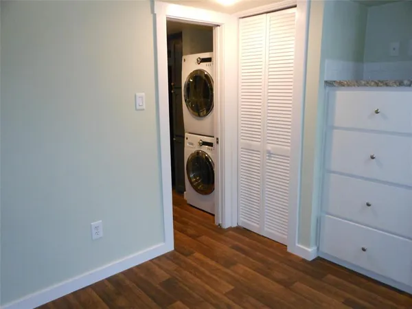a view of a hallway with washer and dryer