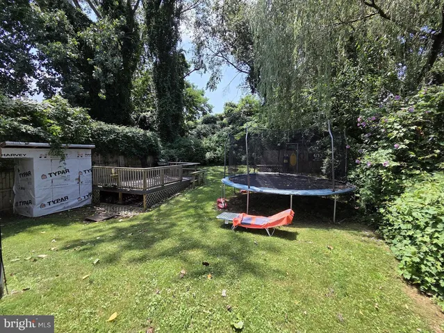 a living room with a couch and a stove