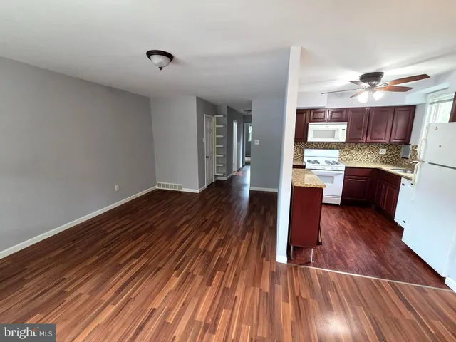 a view of kitchen and wooden floor