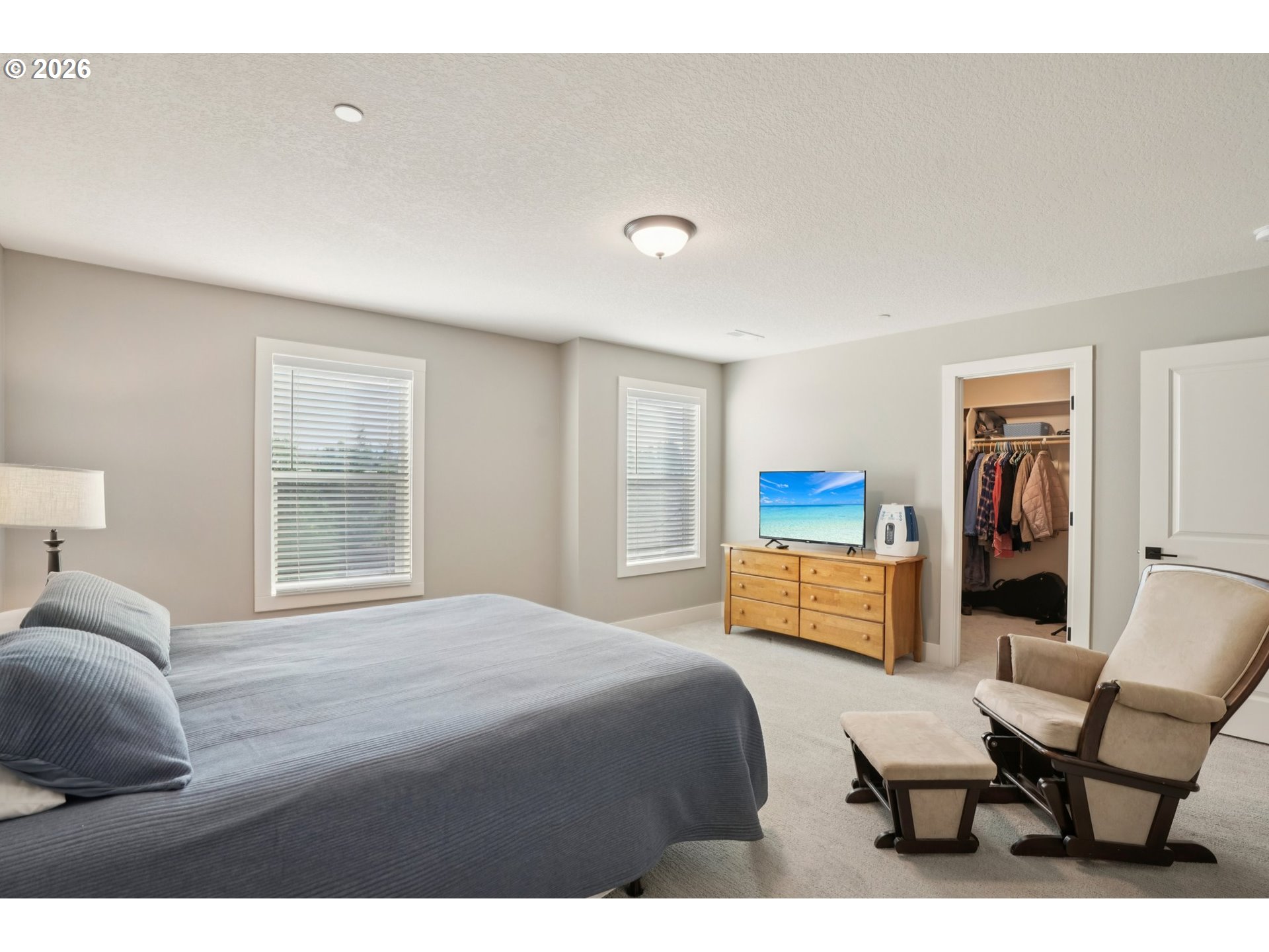 2045 34th Street Washougal, WA 98671 - Photo 13 of 24 a bedroom with a bed and a couch