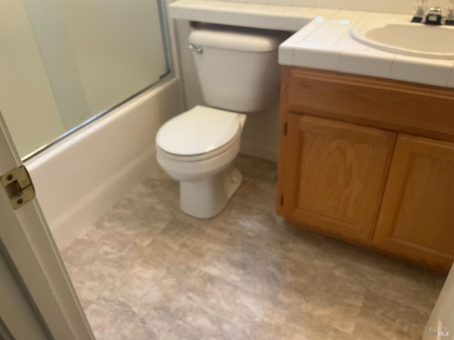 9131 Benny Goodman Way Windsor, CA 95492 - Photo 12 of 27 a white toilet sitting next to a sink
