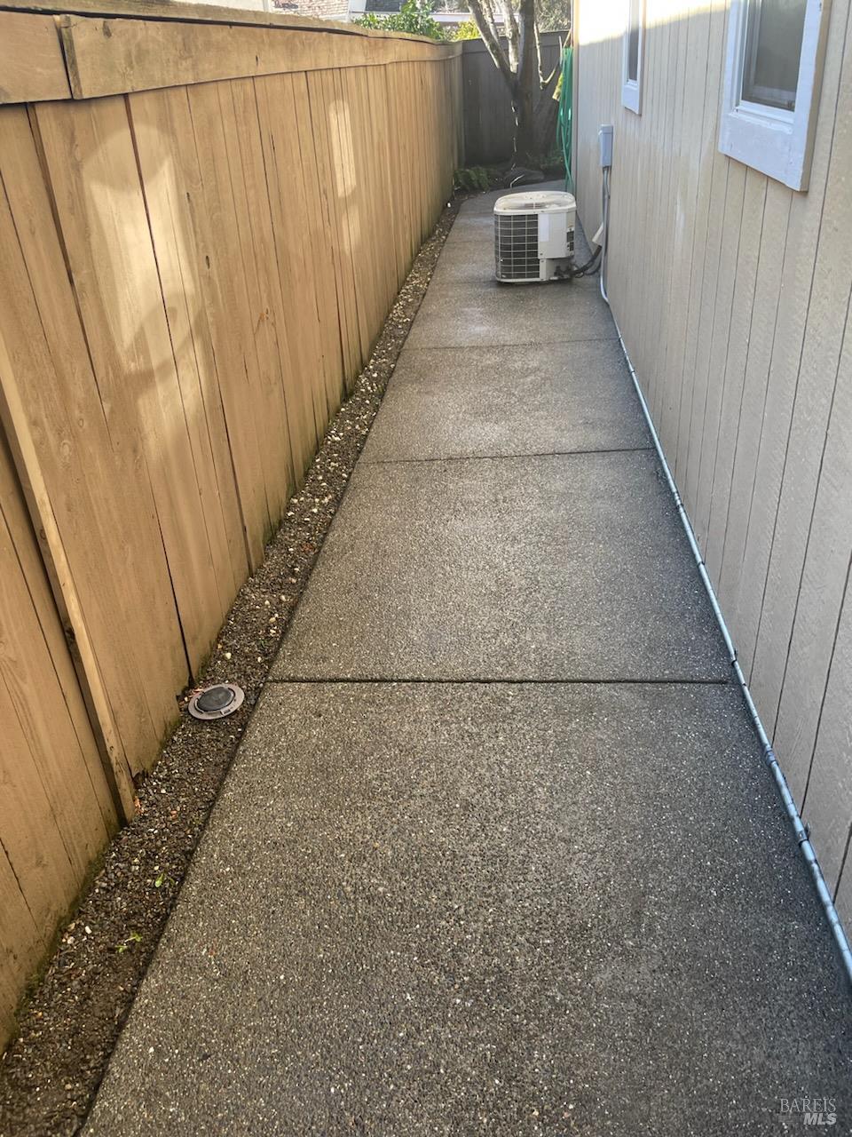 9131 Benny Goodman Way Windsor, CA 95492 - Photo 25 of 27 a view of a pathway of a building with wooden fence