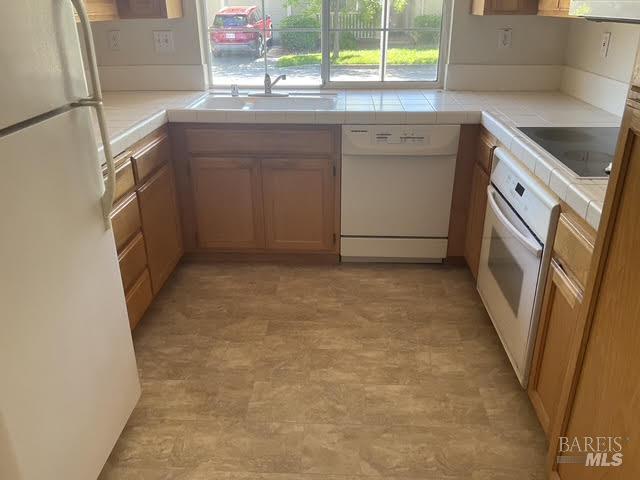 9131 Benny Goodman Way Windsor, CA 95492 - Photo 6 of 27 a kitchen with a sink stove and cabinets