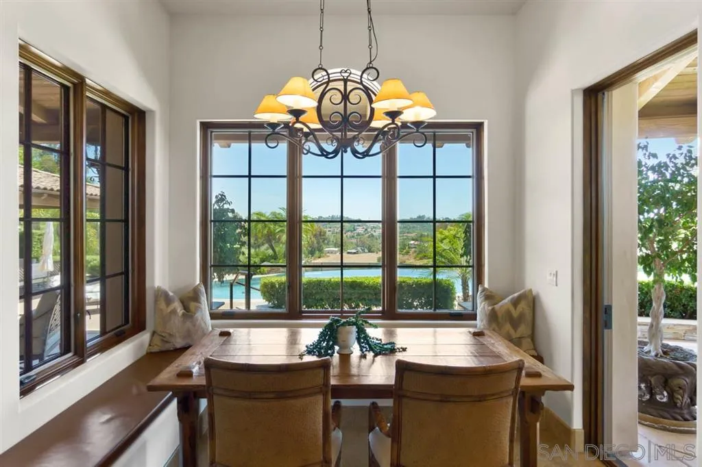 Encinitas, CA 92024 - Photo 11 of 25 a view of a dining room with furniture window and outside view