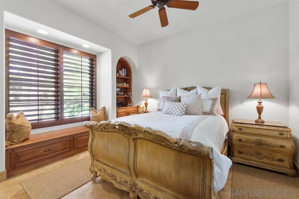 Encinitas, CA 92024 - Photo 17 of 25 a bedroom with a bed and a window