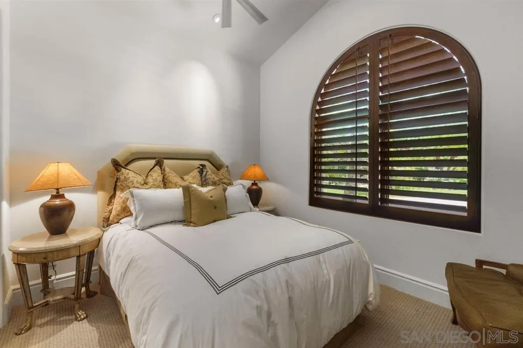 Encinitas, CA 92024 - Photo 22 of 25 a bedroom with a bed and a window